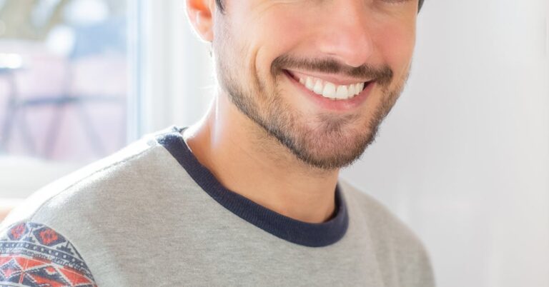 Man with a confident even smile after composite bonding in Archway