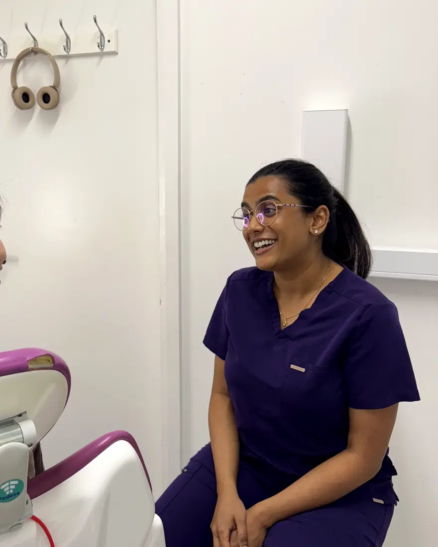 Dr Sanyukta laughing with a patient in the treatment room