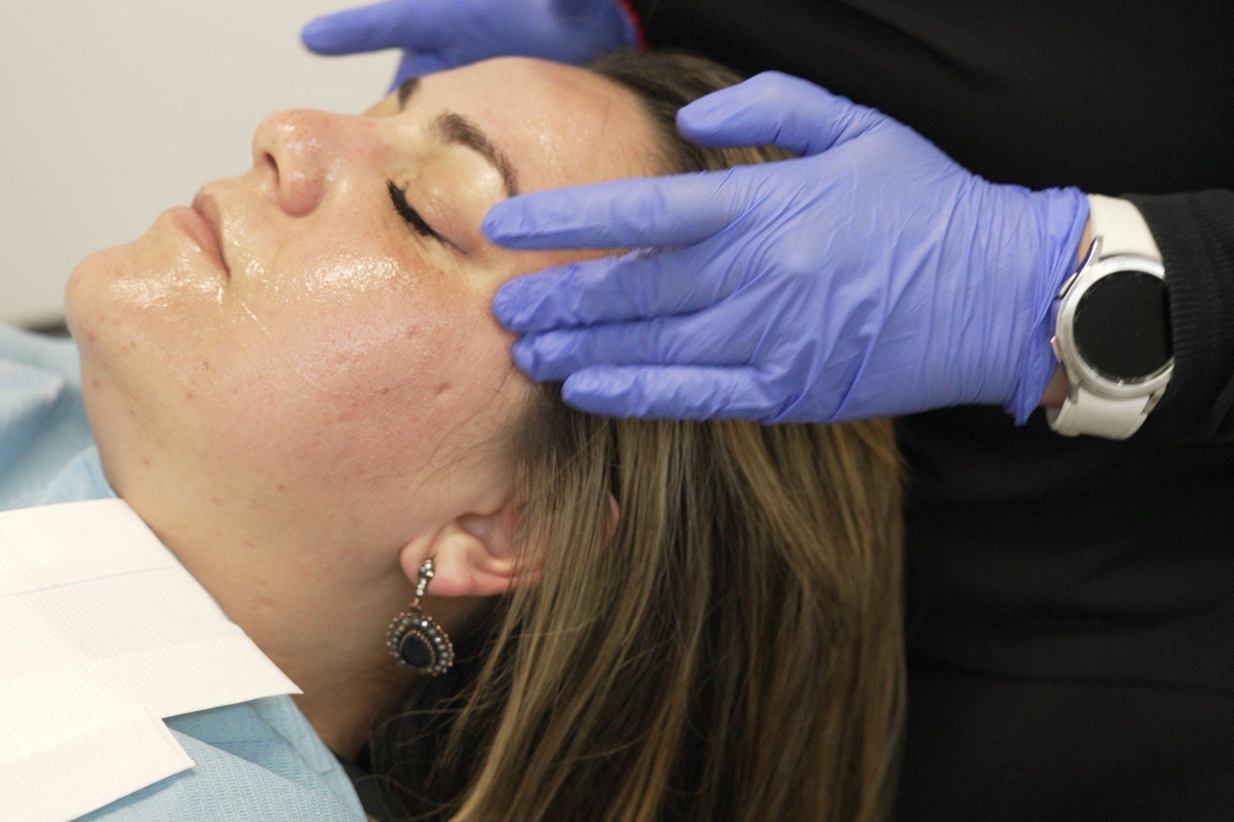 Gentle hands-on facial treatment at Blue Light Dental & Aesthetics, Archway