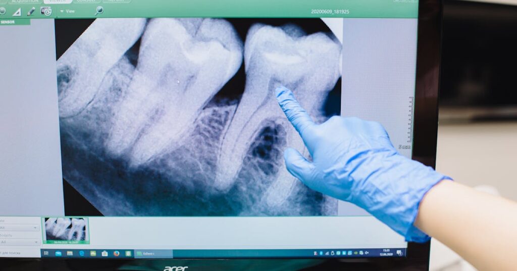Dentist showing a screen pointing to a missing tooth where a dental implant could go