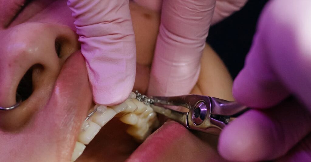 Close-up of a dentist examining a patient's teeth at a first hygiene appointment
